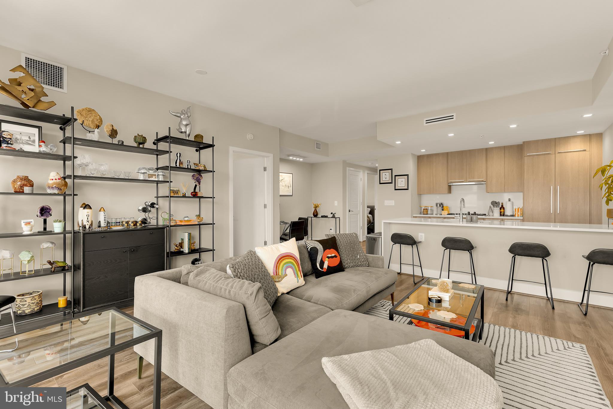 1628 11th Street Northwest, Unit 308 Washington, DC 20001 - Photo 1 of 26 a living room with furniture and a kitchen view