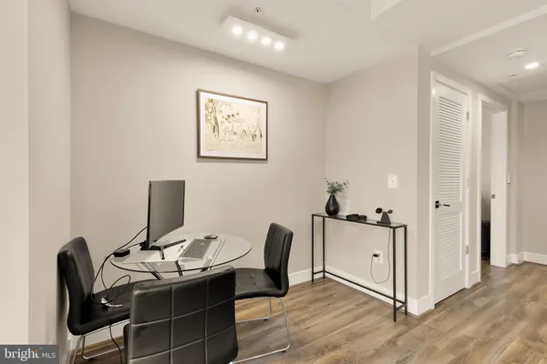a view of workspace with wooden floor