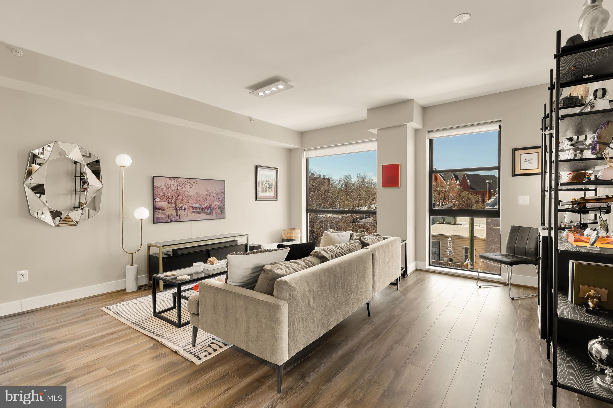 1628 11th Street Northwest, Unit 308 Washington, DC 20001 - Photo 13 of 26 a living room with furniture and a flat screen tv