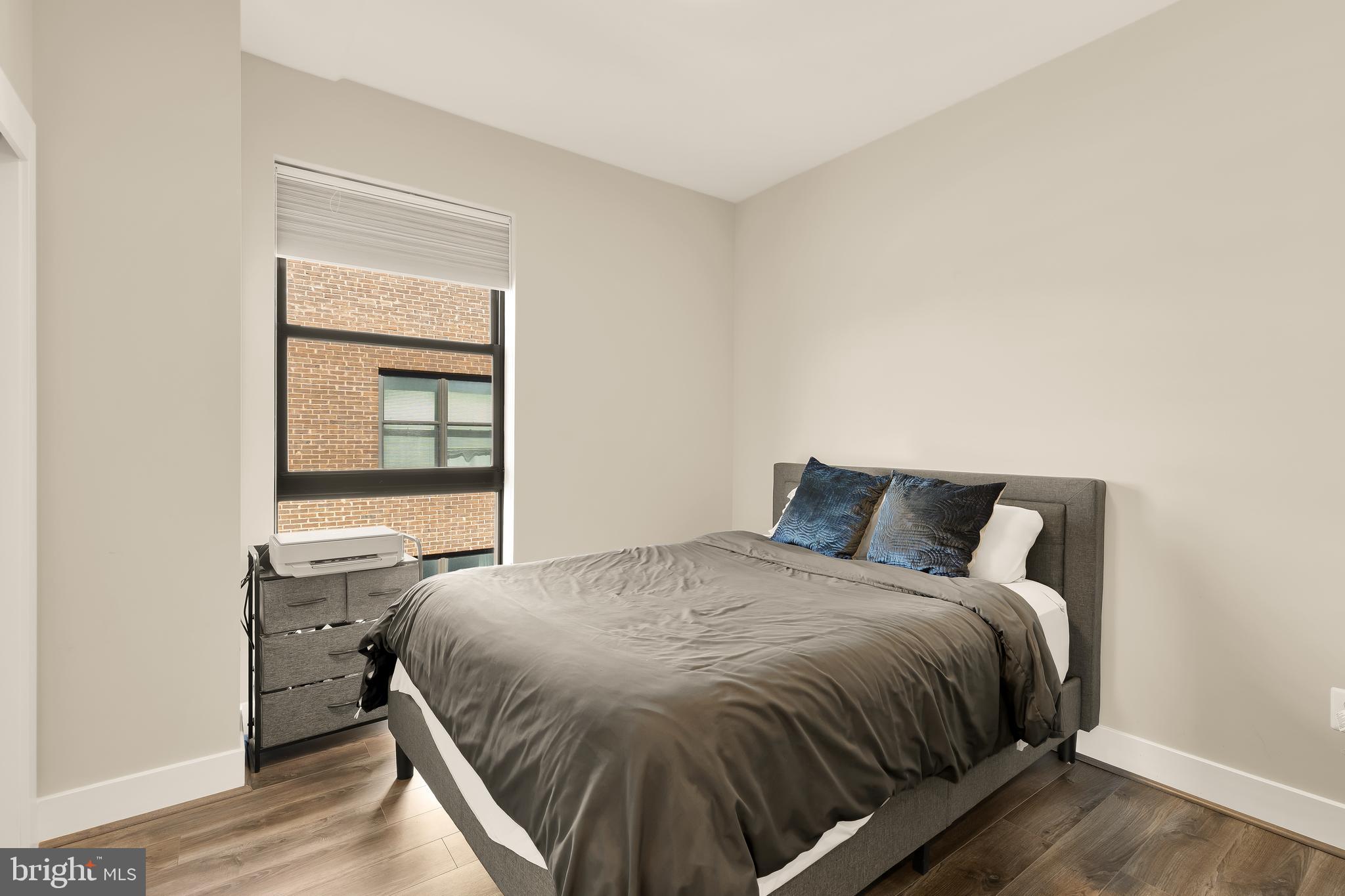 1628 11th Street Northwest, Unit 308 Washington, DC 20001 - Photo 18 of 26 a bedroom with a bed and window