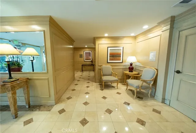 a bathroom with a glass door shower and a sink