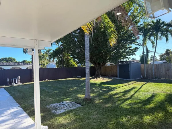 a view of a backyard with a small cabin