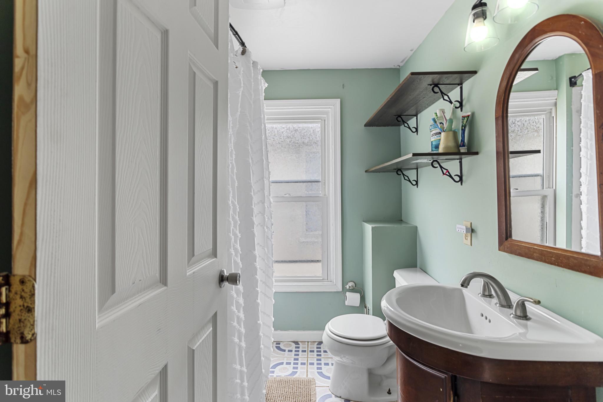 141 West King Street Littlestown, PA 17340 - Photo 20 of 31 a bathroom with a sink and a mirror