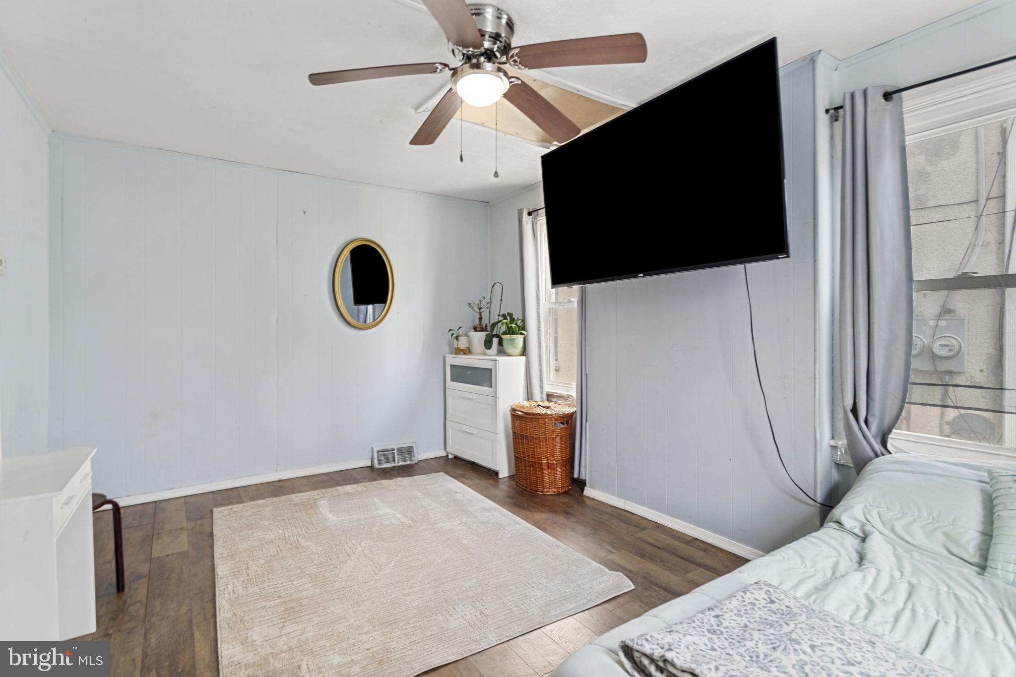 141 West King Street Littlestown, PA 17340 - Photo 21 of 31 a view of a livingroom with wooden floor and flat screen tv