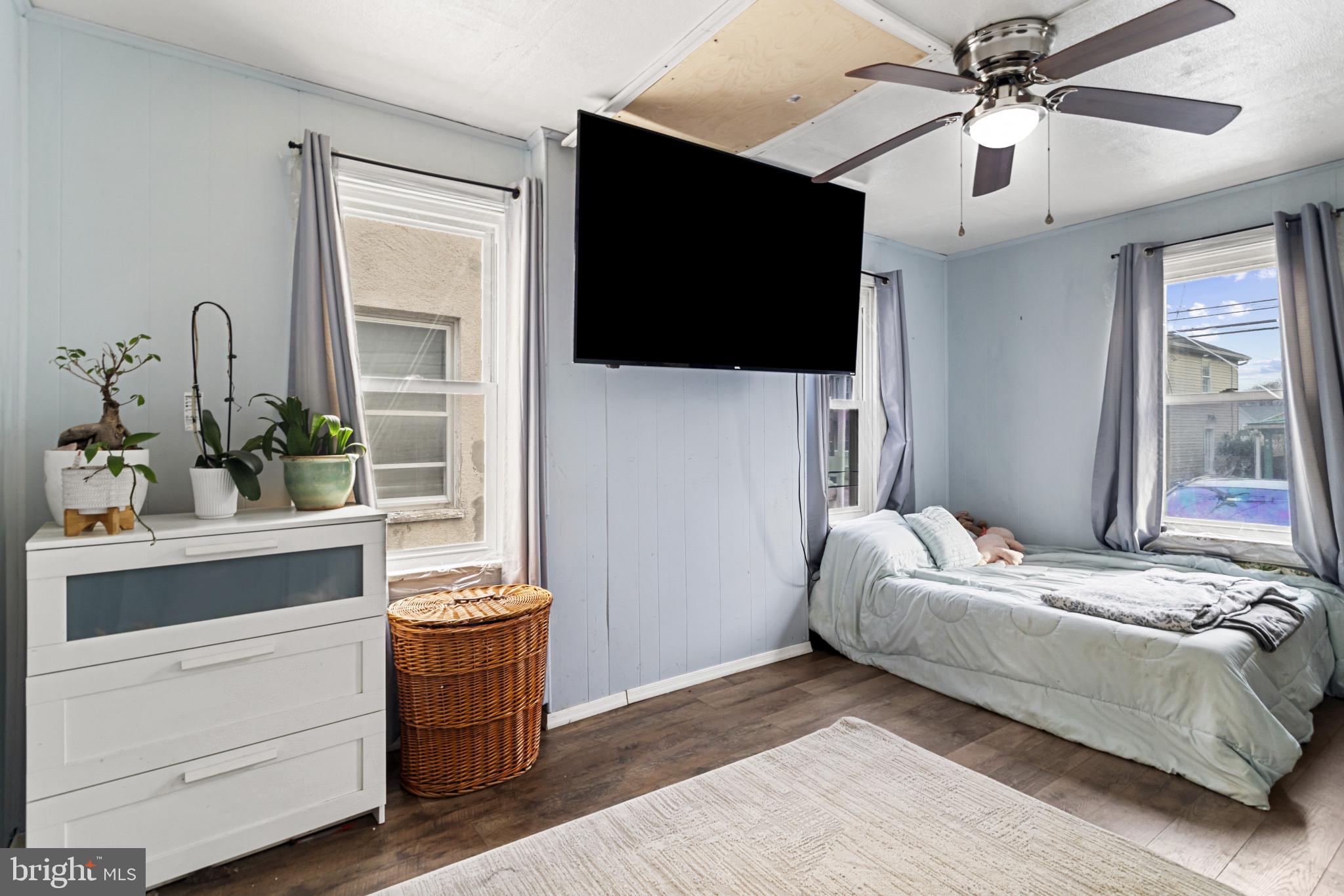 141 West King Street Littlestown, PA 17340 - Photo 23 of 31 a bedroom with a bed and a flat screen tv