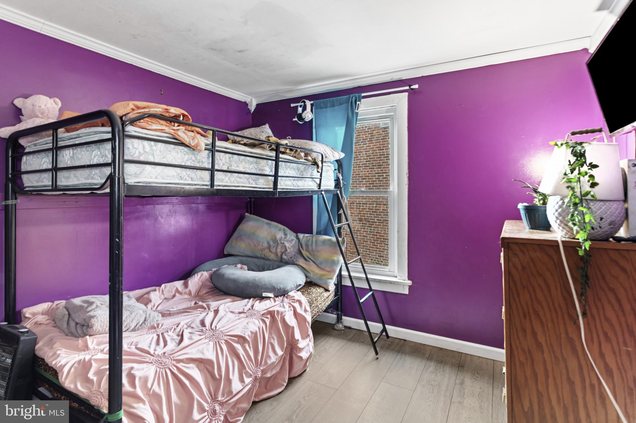 141 West King Street Littlestown, PA 17340 - Photo 26 of 31 a bedroom with a bed and a potted plant