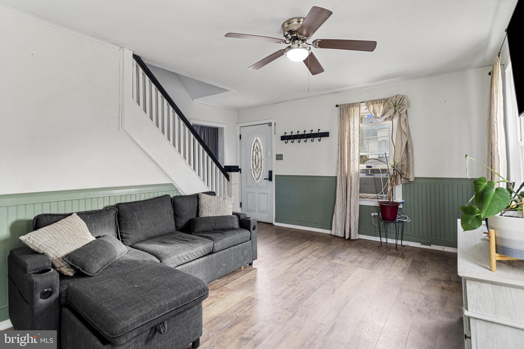 141 West King Street Littlestown, PA 17340 - Photo 5 of 31 a living room with furniture and wooden floor