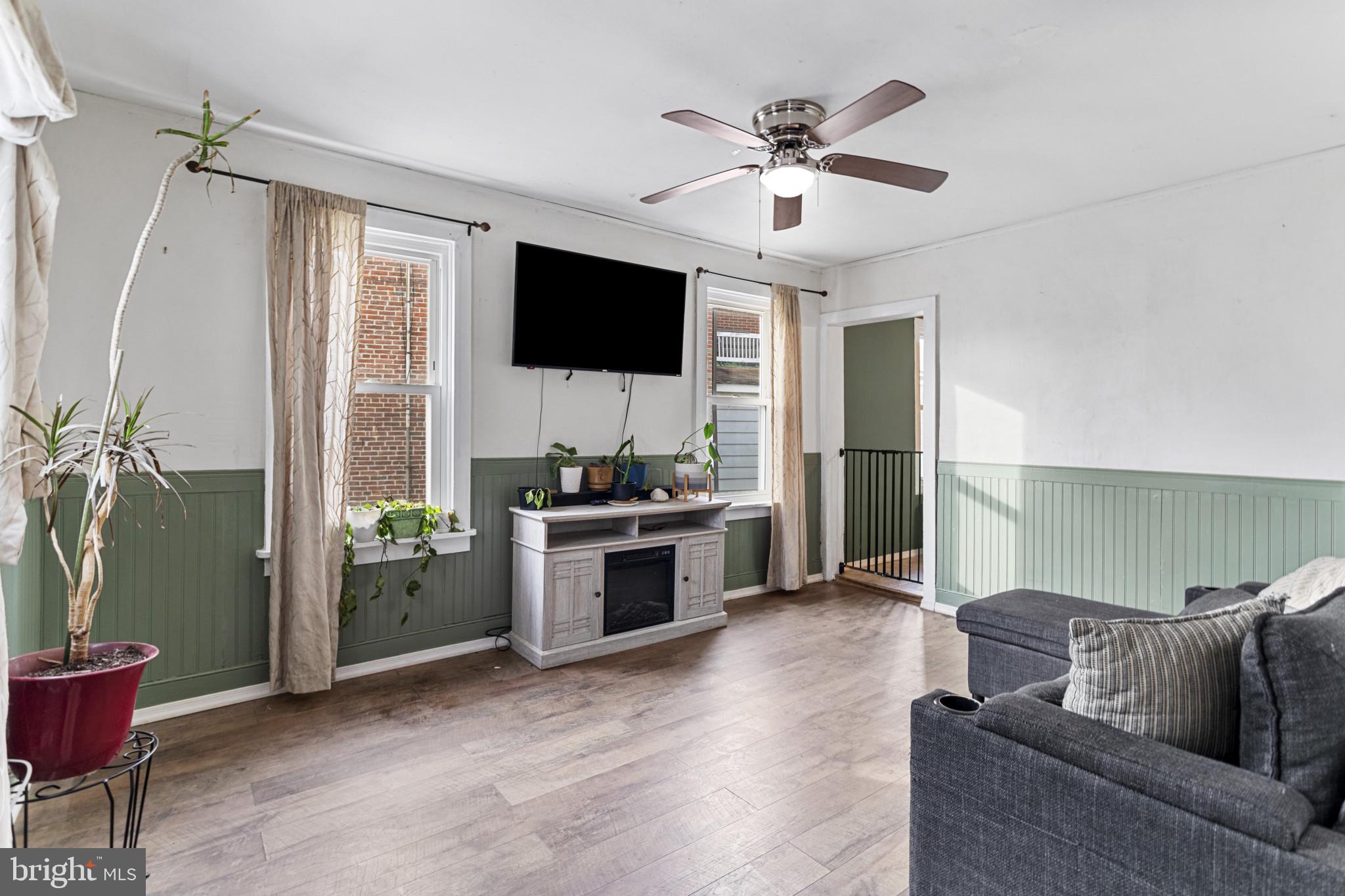 141 West King Street Littlestown, PA 17340 - Photo 7 of 31 a living room with furniture and a flat screen tv