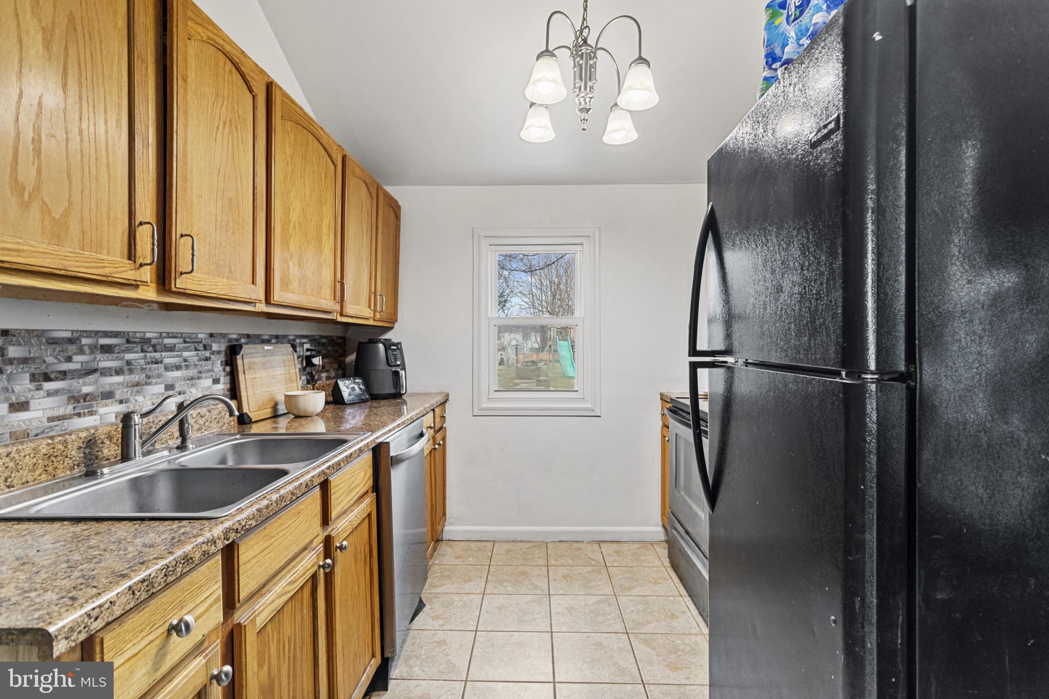 141 West King Street Littlestown, PA 17340 - Photo 9 of 31 a kitchen with stainless steel appliances granite countertop a refrigerator a sink dishwasher with a stove and refrigerator