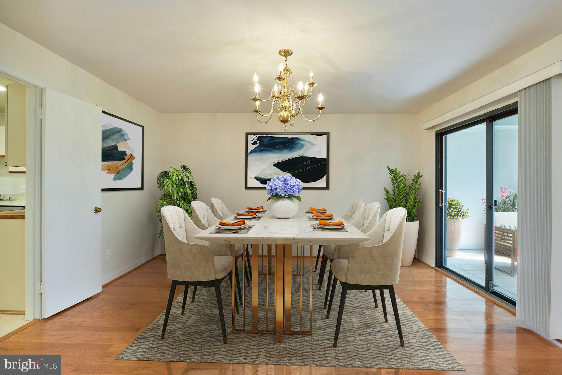 11500 Fairway Drive, Unit 101 Reston, VA 20190 - Photo 13 of 40 a view of a dining room with furniture wooden floor and a chandelier