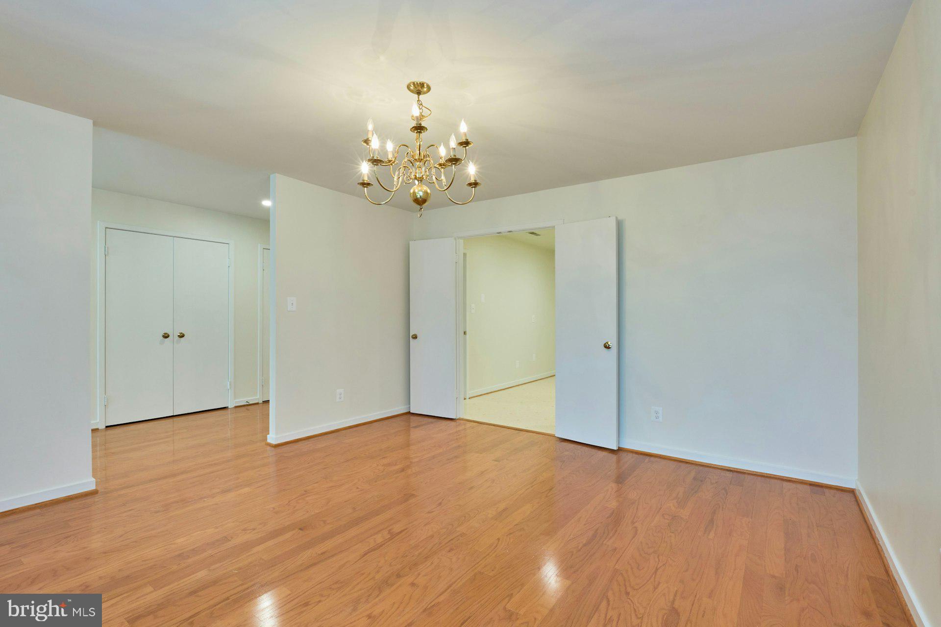 11500 Fairway Drive, Unit 101 Reston, VA 20190 - Photo 15 of 40 a view of an empty room with wooden floor