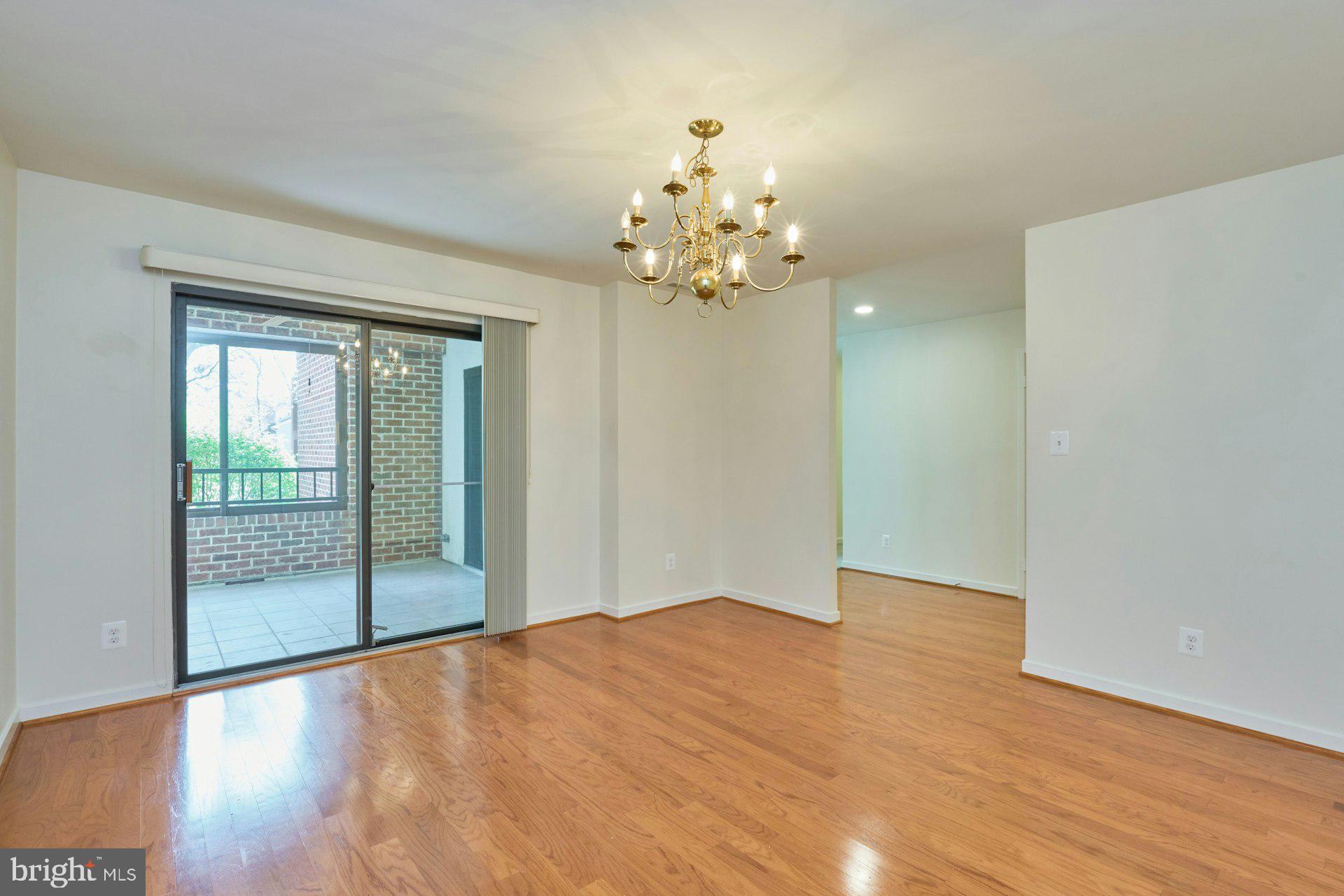 11500 Fairway Drive, Unit 101 Reston, VA 20190 - Photo 17 of 40 a view of an empty room with glass door