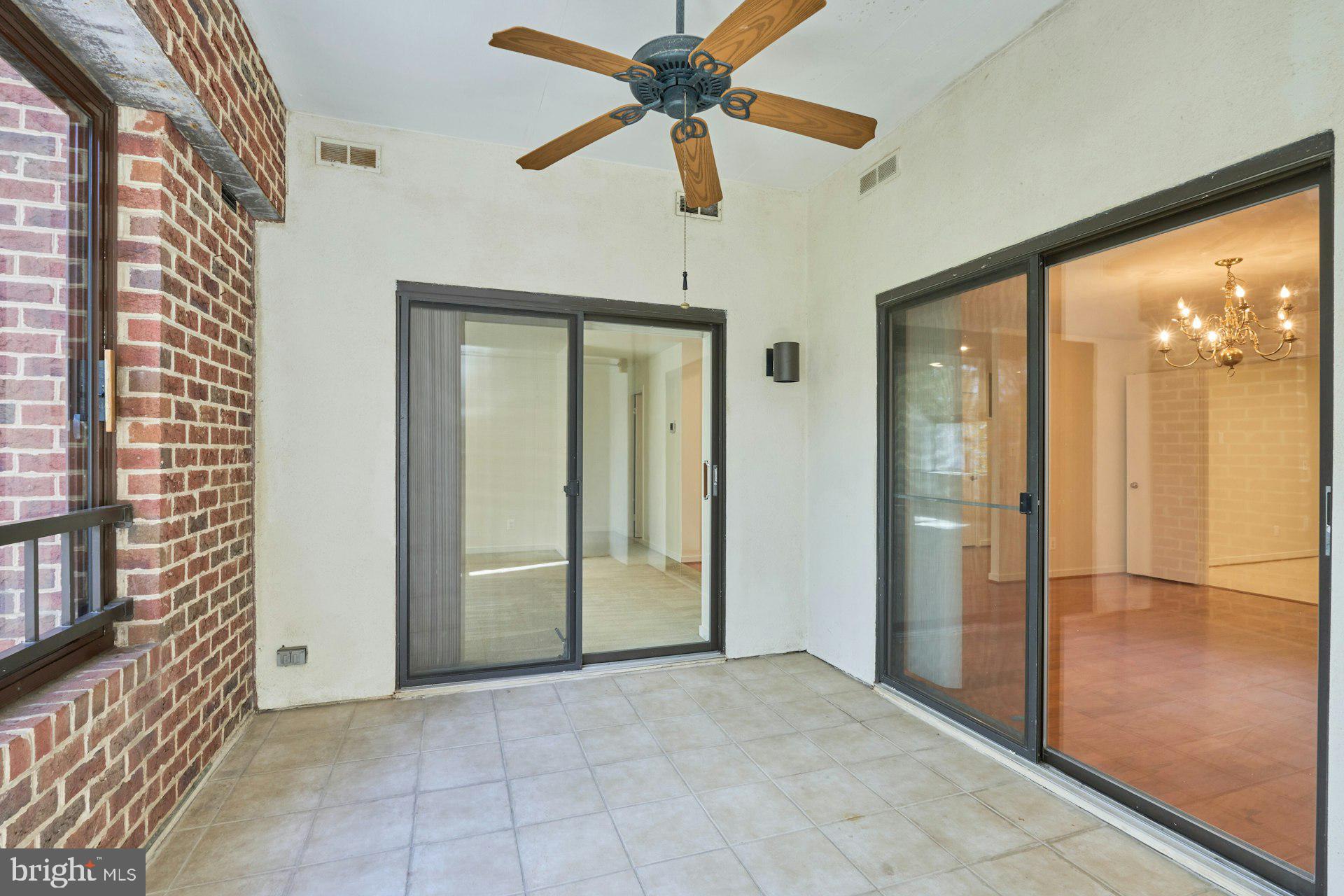 11500 Fairway Drive, Unit 101 Reston, VA 20190 - Photo 18 of 40 a view of empty room with a ceiling fan and window