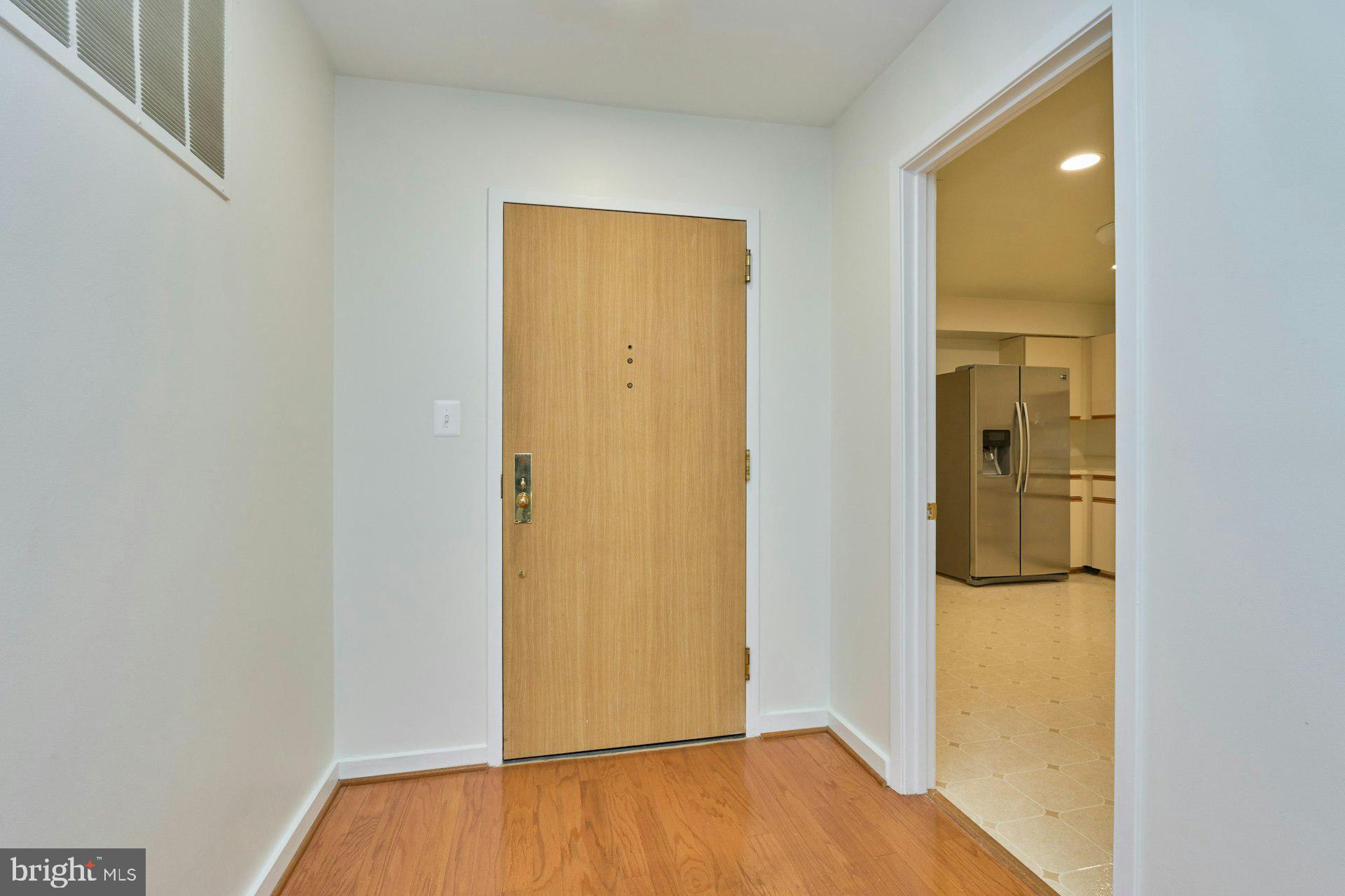 11500 Fairway Drive, Unit 101 Reston, VA 20190 - Photo 20 of 40 a view of front door with wooden floor