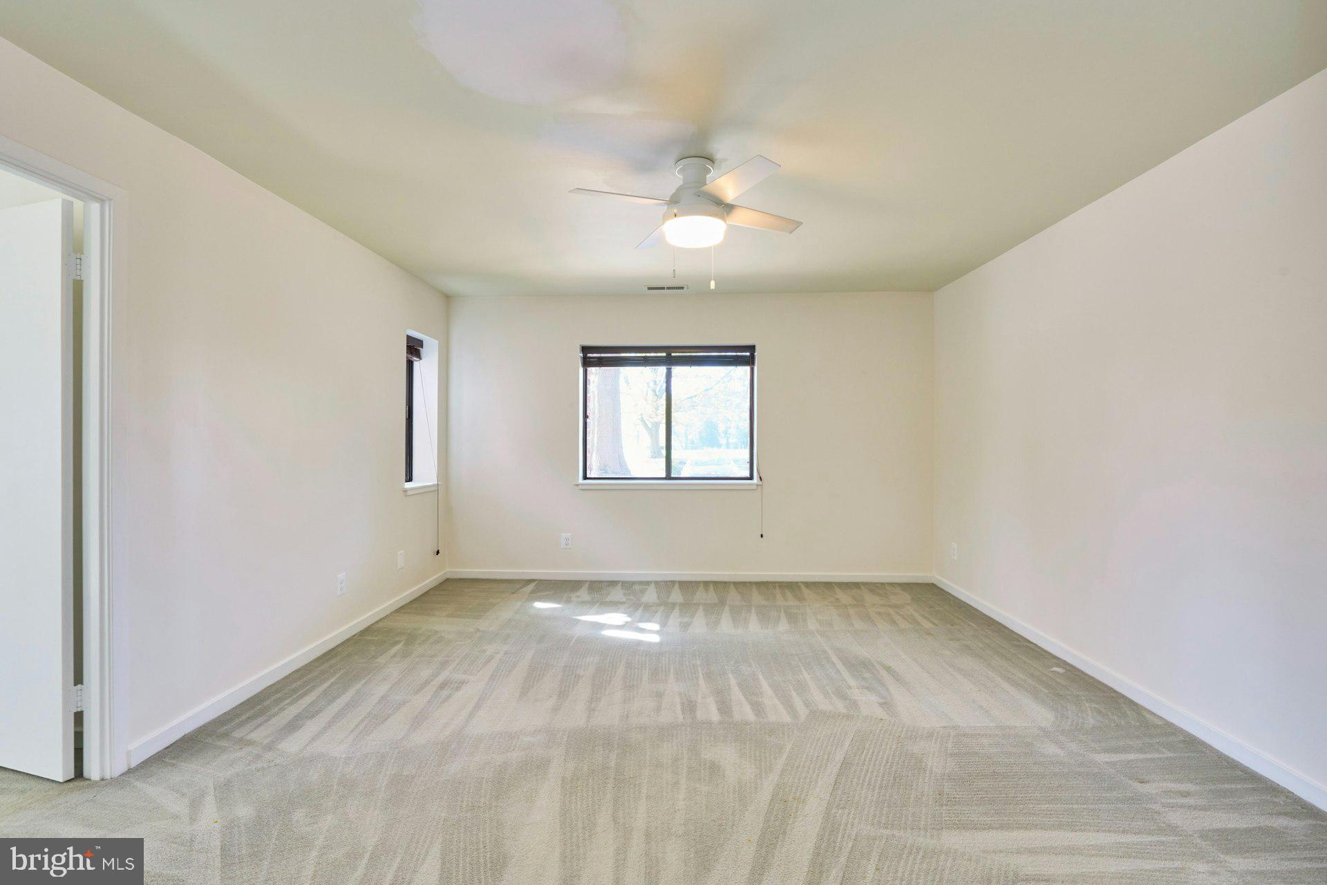 11500 Fairway Drive, Unit 101 Reston, VA 20190 - Photo 27 of 40 wooden floor in an empty room with a window