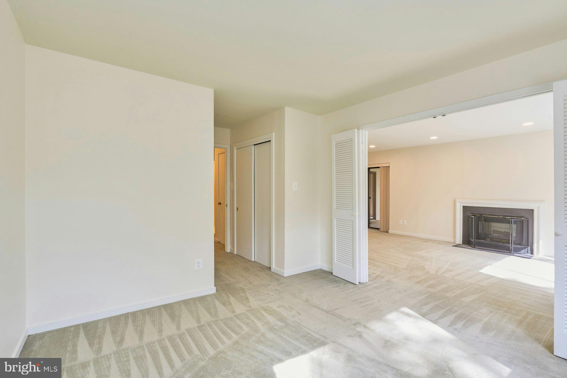11500 Fairway Drive, Unit 101 Reston, VA 20190 - Photo 30 of 40 a view of a livingroom with an empty space and a fireplace