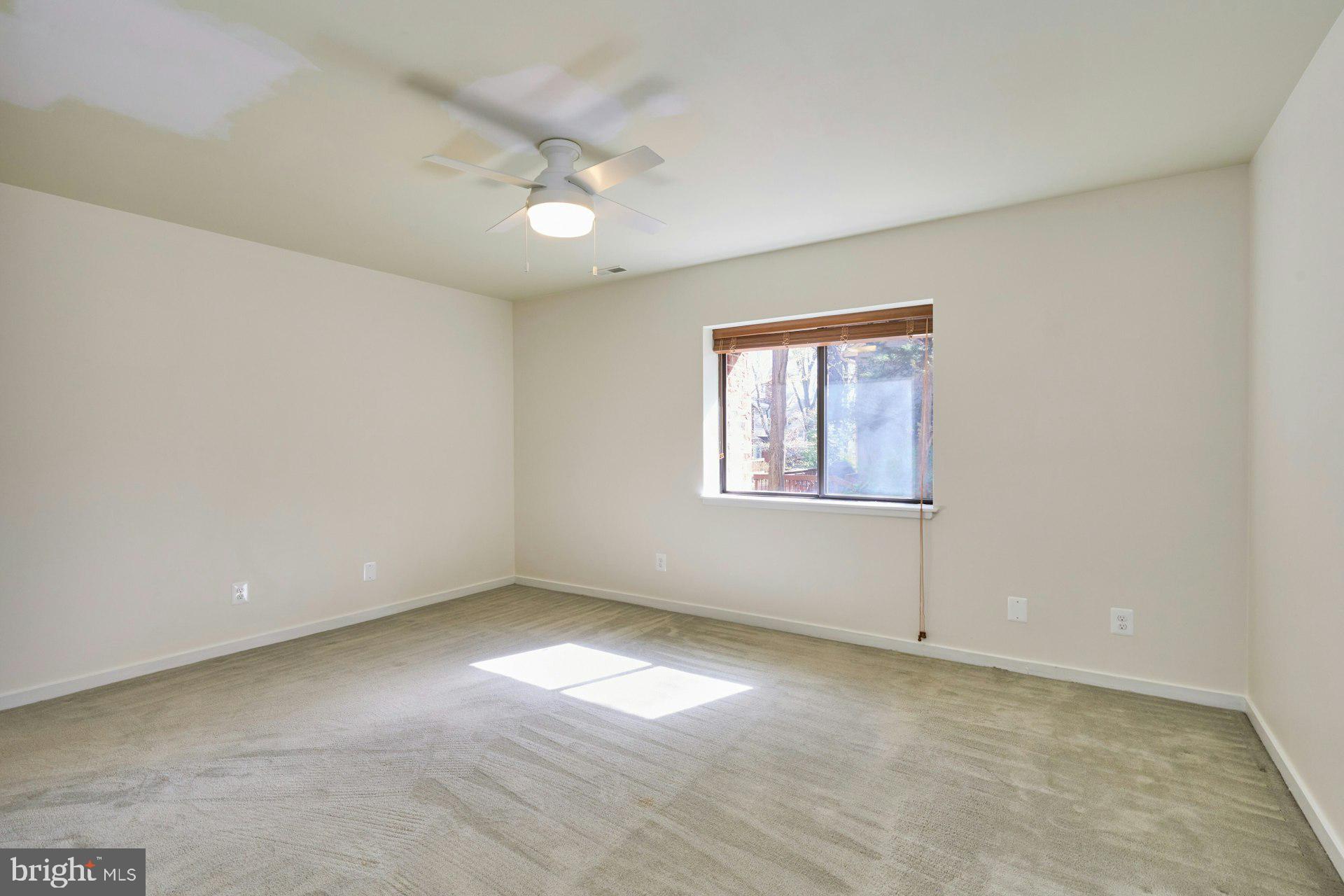 11500 Fairway Drive, Unit 101 Reston, VA 20190 - Photo 33 of 40 wooden floor in an empty room with a window