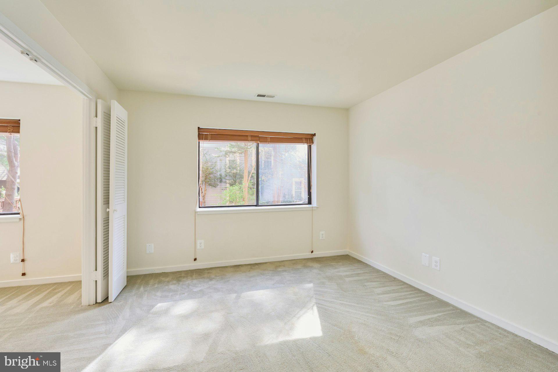 11500 Fairway Drive, Unit 101 Reston, VA 20190 - Photo 34 of 40 an empty room with windows