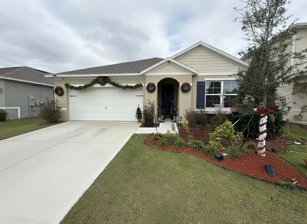 a front view of house with yard outdoor seating and barbeque oven