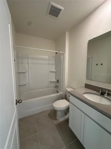 a view of an empty room and entryway