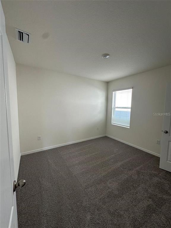 3767 Paragon Lane Clermont, FL 34714 - Photo 16 of 19 an empty room with windows