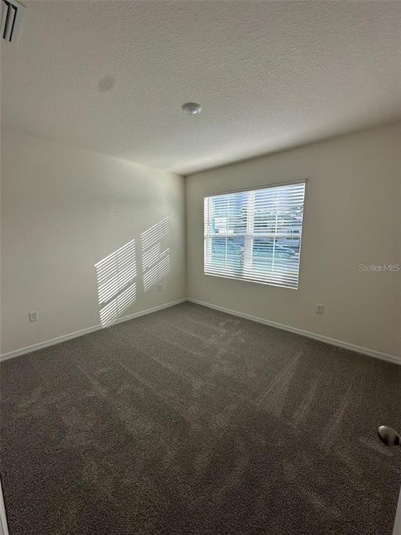 3767 Paragon Lane Clermont, FL 34714 - Photo 17 of 19 an empty room with windows