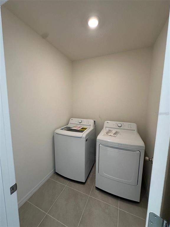 3767 Paragon Lane Clermont, FL 34714 - Photo 19 of 19 a utility room with dryer and washer