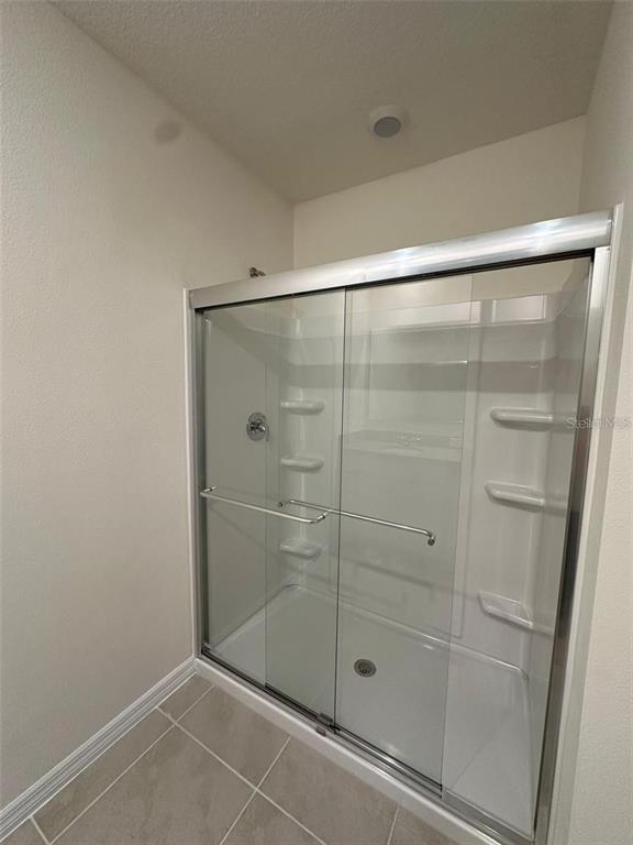 3767 Paragon Lane Clermont, FL 34714 - Photo 3 of 19 a bathroom with a shower