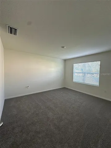 a kitchen with stainless steel appliances a sink stove and cabinets