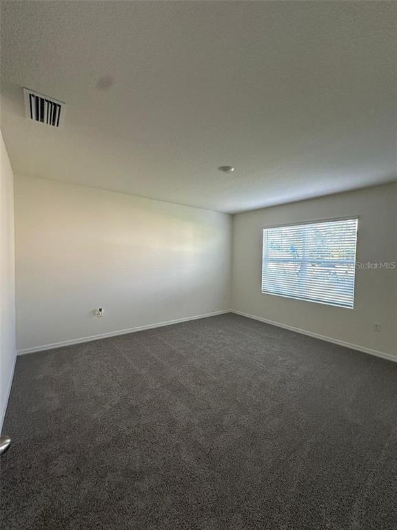 3767 Paragon Lane Clermont, FL 34714 - Photo 9 of 19 a view of an empty room and a window