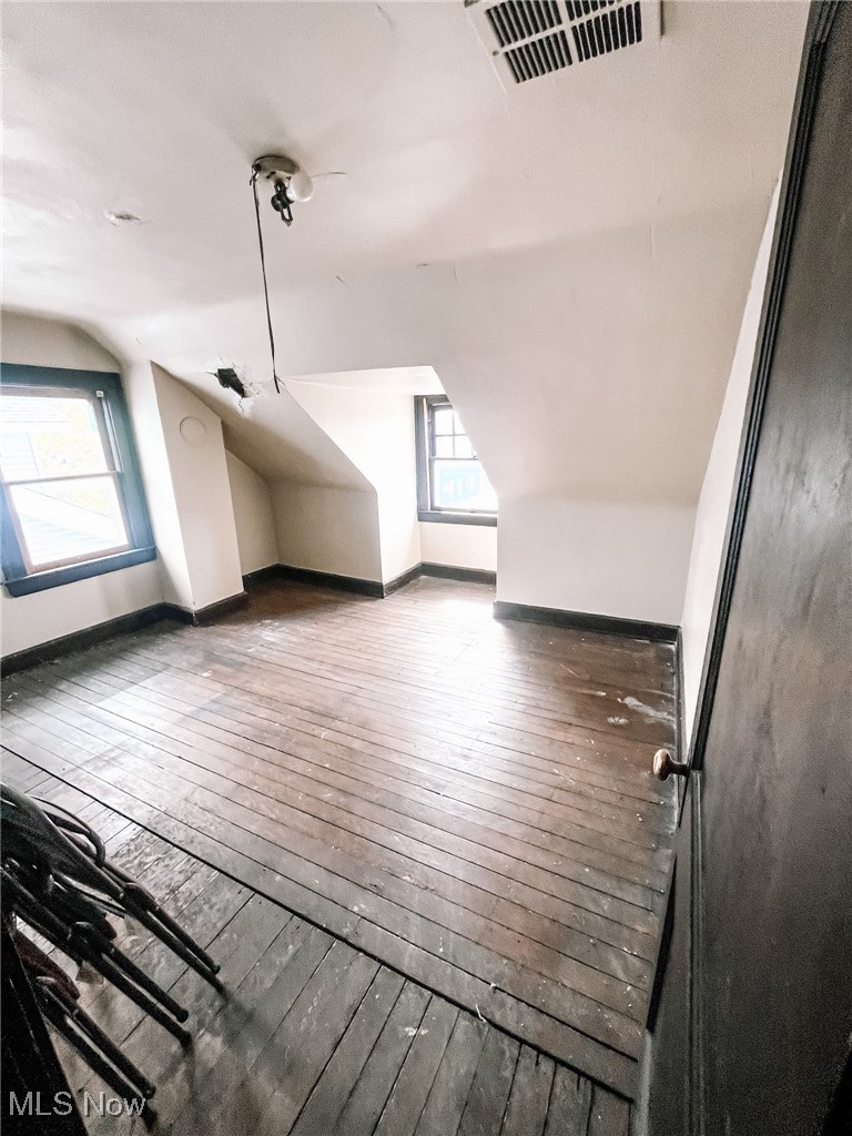 1547 Hillcrest Road Cleveland, OH 44118 - Photo 20 of 23 Third Floor Bedroom featuring lofted ceiling and wood-type flooring