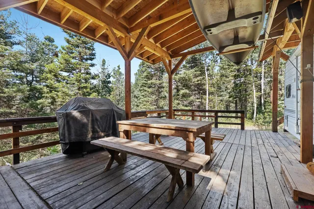 a view of a chairs and table on the deck