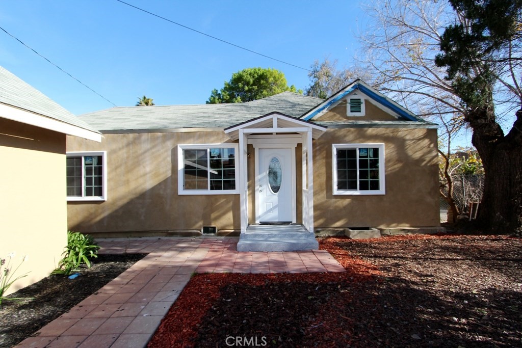 5212 Buffington Road El Monte, CA 91732 - Photo 1 of 1 a front view of a house with a yard