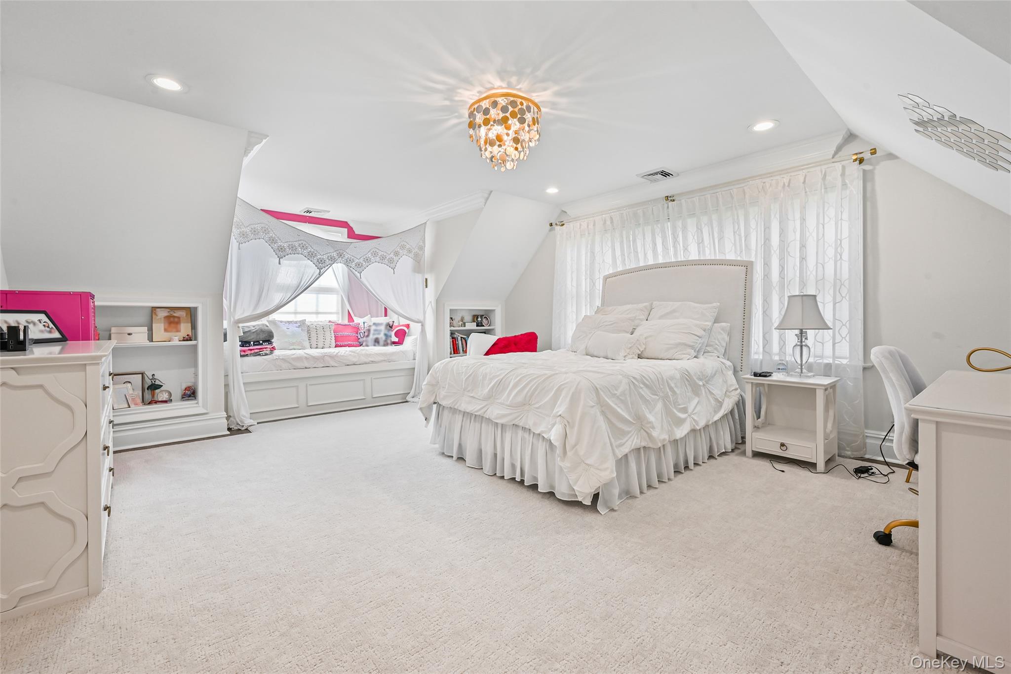 15 High Ridge Lane Oyster Bay, NY 11771 - Photo 13 of 25 a bedroom with a bed and a chandelier