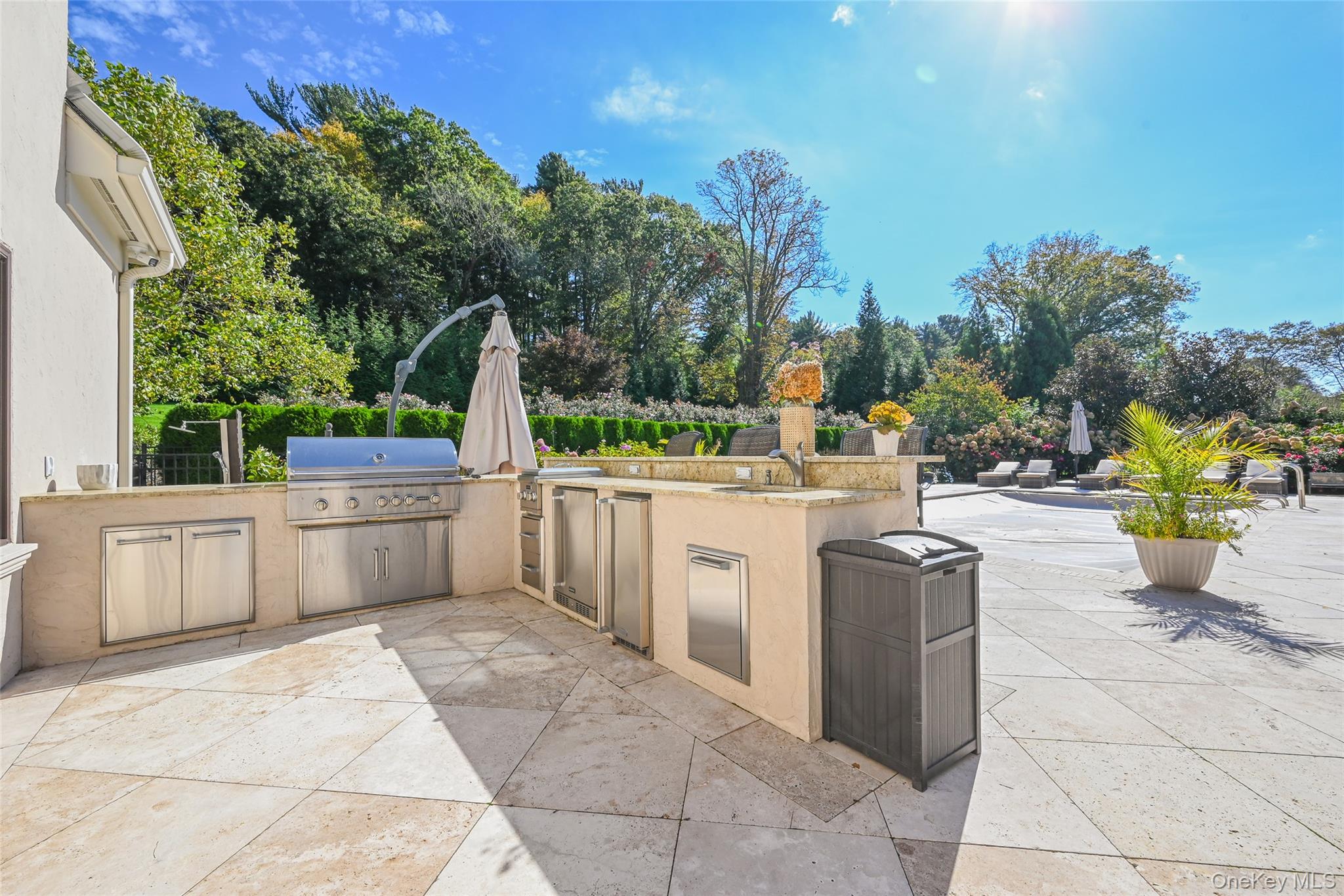 15 High Ridge Lane Oyster Bay, NY 11771 - Photo 14 of 25 a view of a patio with table and chairs