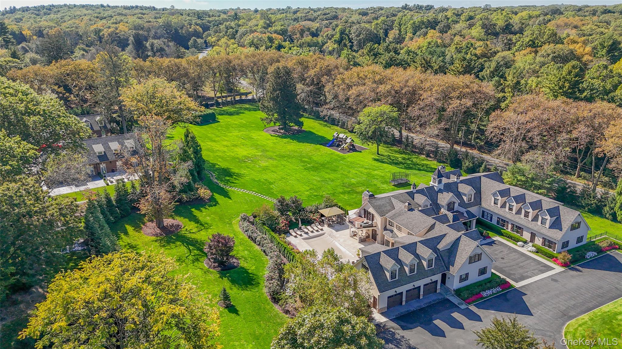 15 High Ridge Lane Oyster Bay, NY 11771 - Photo 24 of 25 an aerial view of a house with a garden and lake view