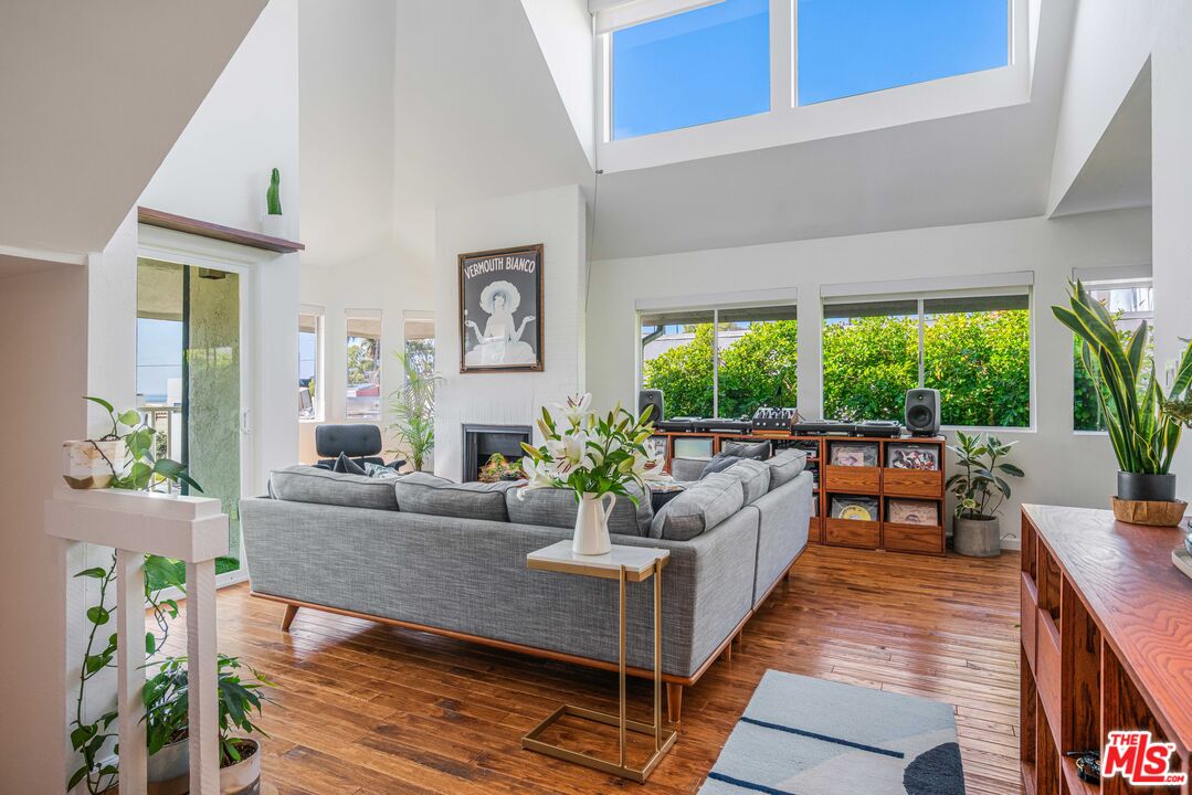 24 Westwind Street, Unit C Marina del Rey, CA 90292 - Photo 27 of 35 a living room with furniture and large windows