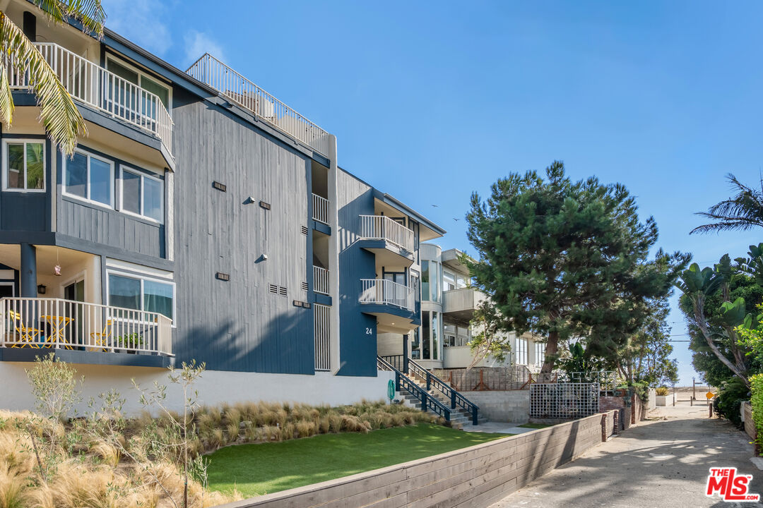 24 Westwind Street, Unit C Marina del Rey, CA 90292 - Photo 28 of 35 a front view of a house with a yard