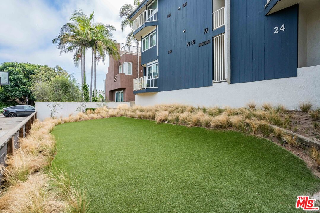 24 Westwind Street, Unit C Marina del Rey, CA 90292 - Photo 31 of 35 a front view of a house with garden