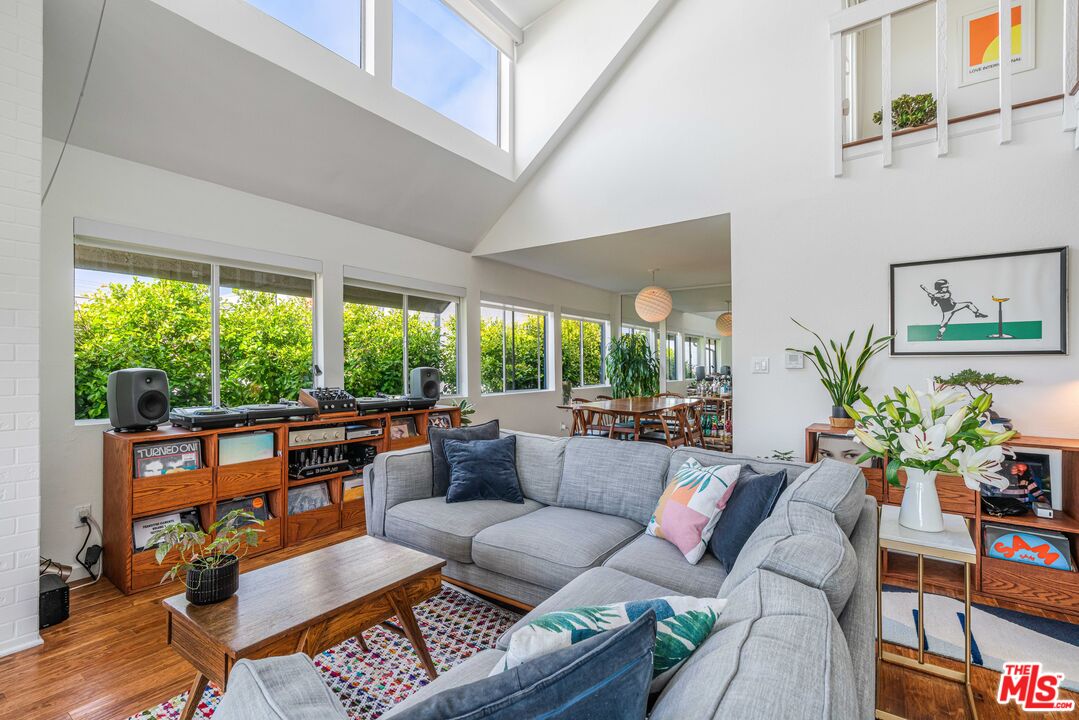 24 Westwind Street, Unit C Marina del Rey, CA 90292 - Photo 9 of 35 a living room with patio furniture and a potted plant