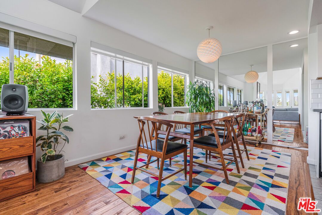24 Westwind Street, Unit C Marina del Rey, CA 90292 - Photo 10 of 35 a view of a dining room with furniture window and wooden floor