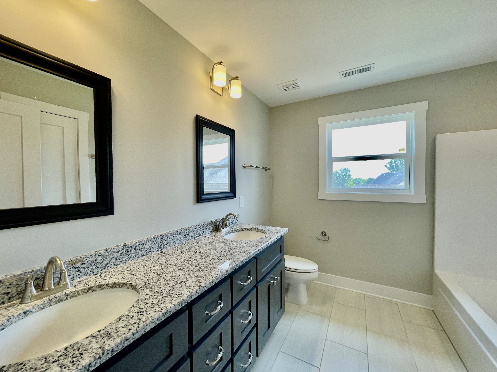 804 Becham Kenneth Circle Smyrna, TN 37167 - Photo 19 of 25 a bathroom with a granite countertop sink toilet and mirror
