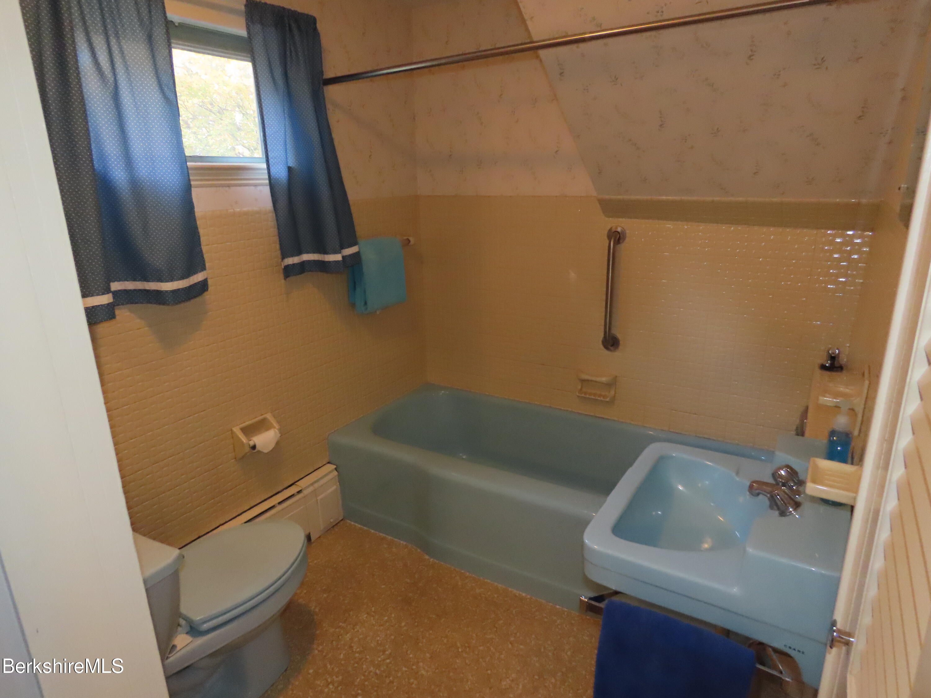 72 Orchard Street Adams, MA 01220 - Photo 35 of 60 a bathroom with a sink a toilet a tub and shower