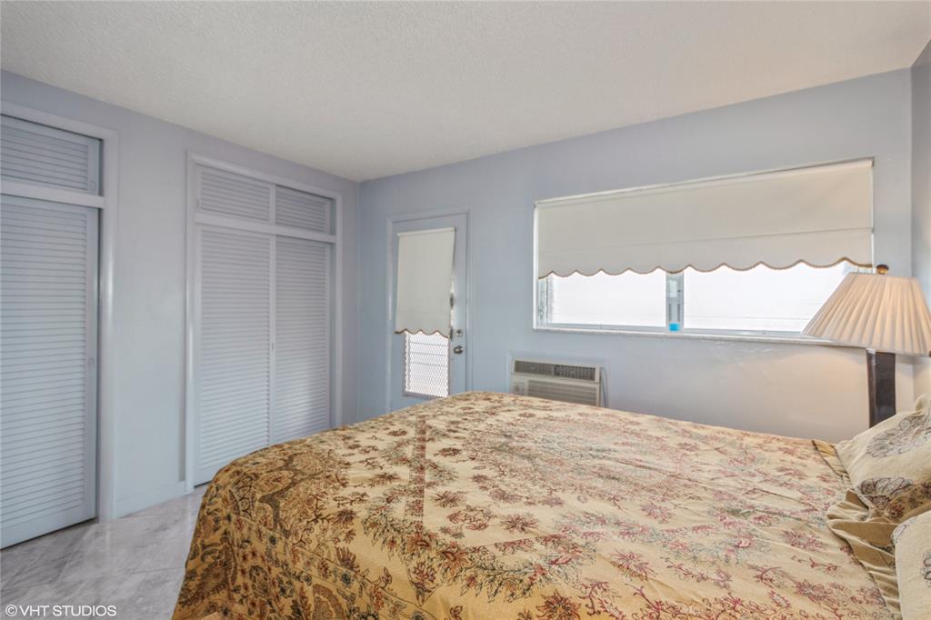 800 Southwest 11th Avenue, Unit 17 Hallandale Beach, FL 33009 - Photo 16 of 18 a bedroom with a bed and a window