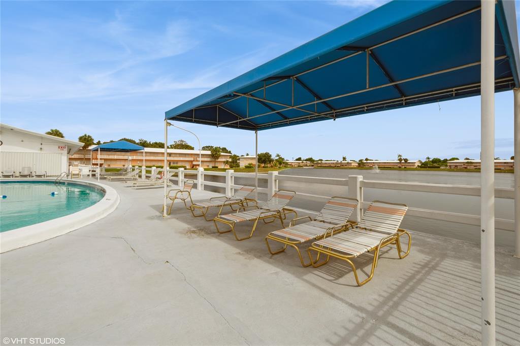 800 Southwest 11th Avenue, Unit 17 Hallandale Beach, FL 33009 - Photo 18 of 18 a terrace with outdoor seating and city view