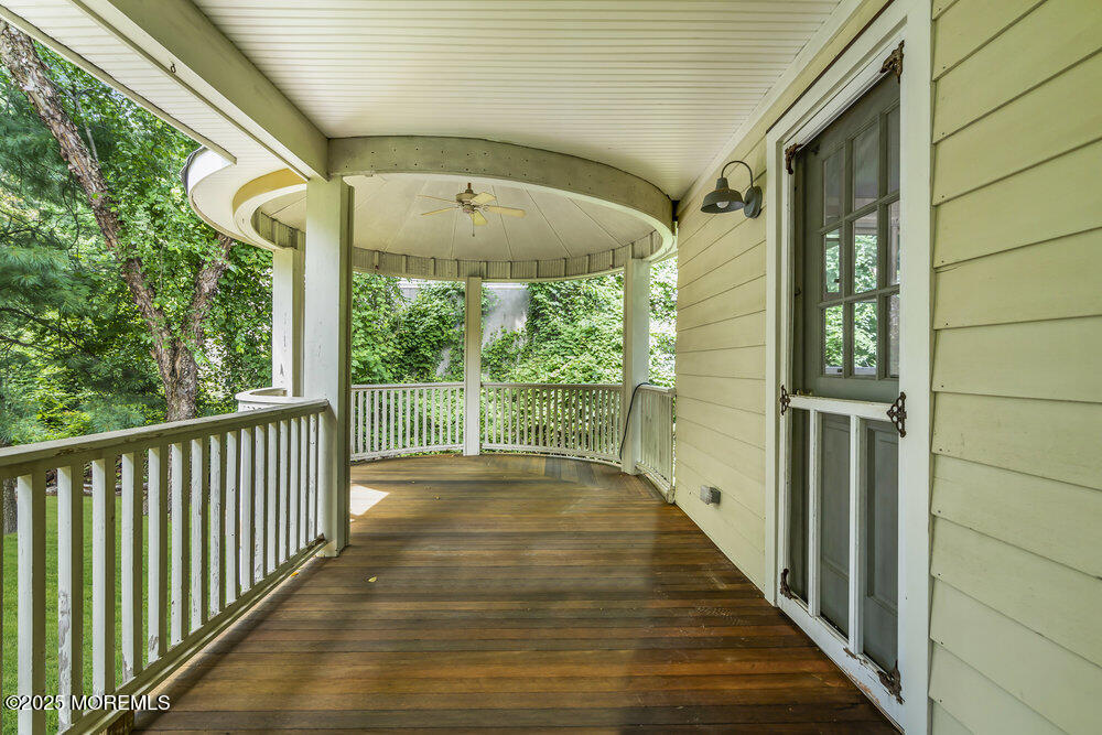 a view of balcony with wooden floor