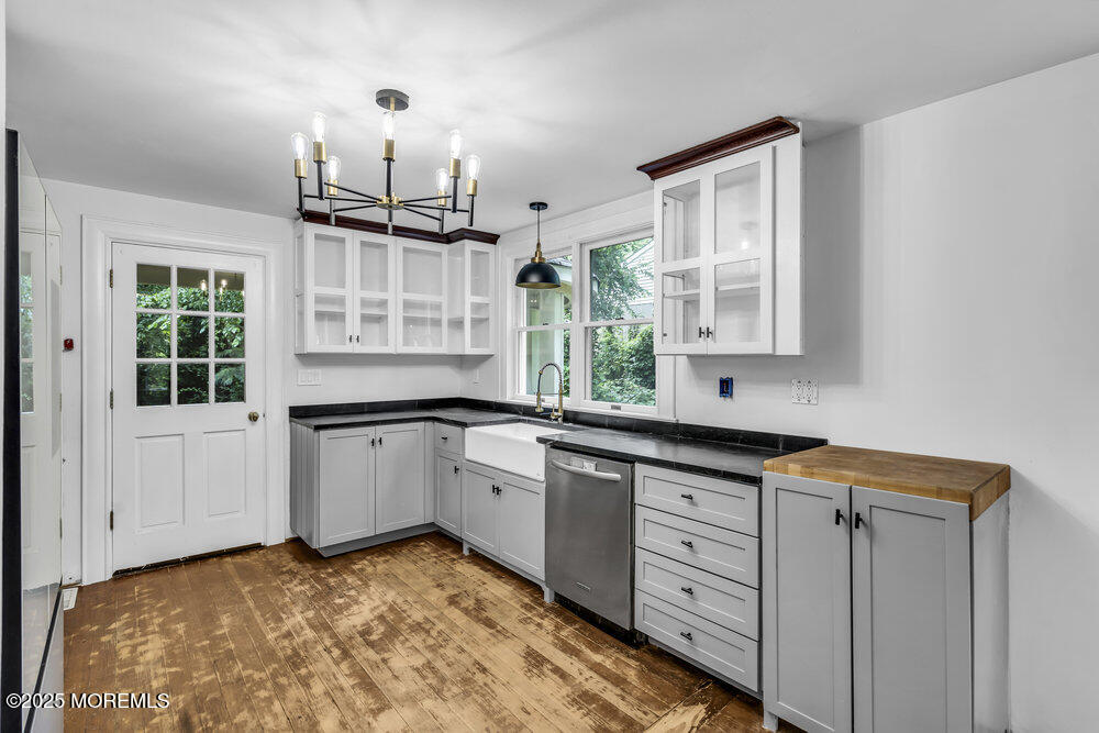 4 Oneida Avenue Atlantic Highlands, NJ 07716 - Photo 13 of 80 a kitchen with white cabinets and window