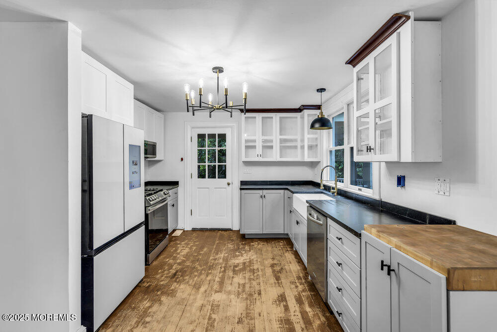 4 Oneida Avenue Atlantic Highlands, NJ 07716 - Photo 14 of 80 a kitchen with stainless steel appliances a refrigerator sink and cabinets
