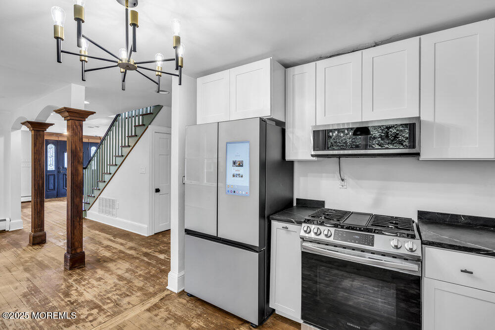 4 Oneida Avenue Atlantic Highlands, NJ 07716 - Photo 15 of 80 a kitchen with stainless steel appliances granite countertop a stove a refrigerator and a refrigerator