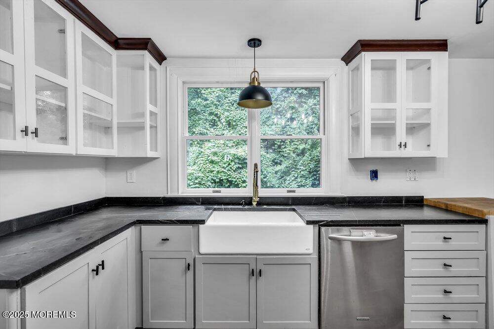 4 Oneida Avenue Atlantic Highlands, NJ 07716 - Photo 16 of 80 a kitchen with a sink and cabinets